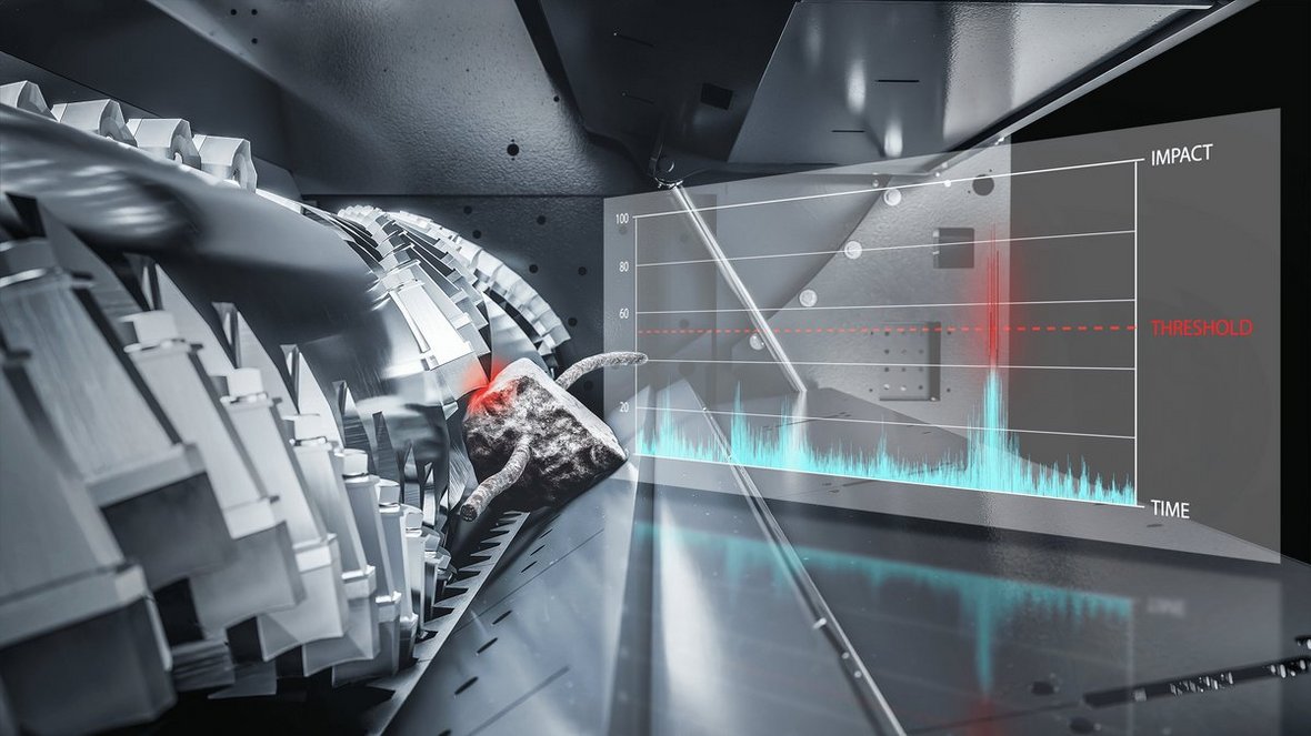 System wykrywania ciał obcych w rozdrabniaczu Vecoplan VEZ 3300 z hydrauliczną klapą dna do szybkiego usuwania zanieczyszczeń.